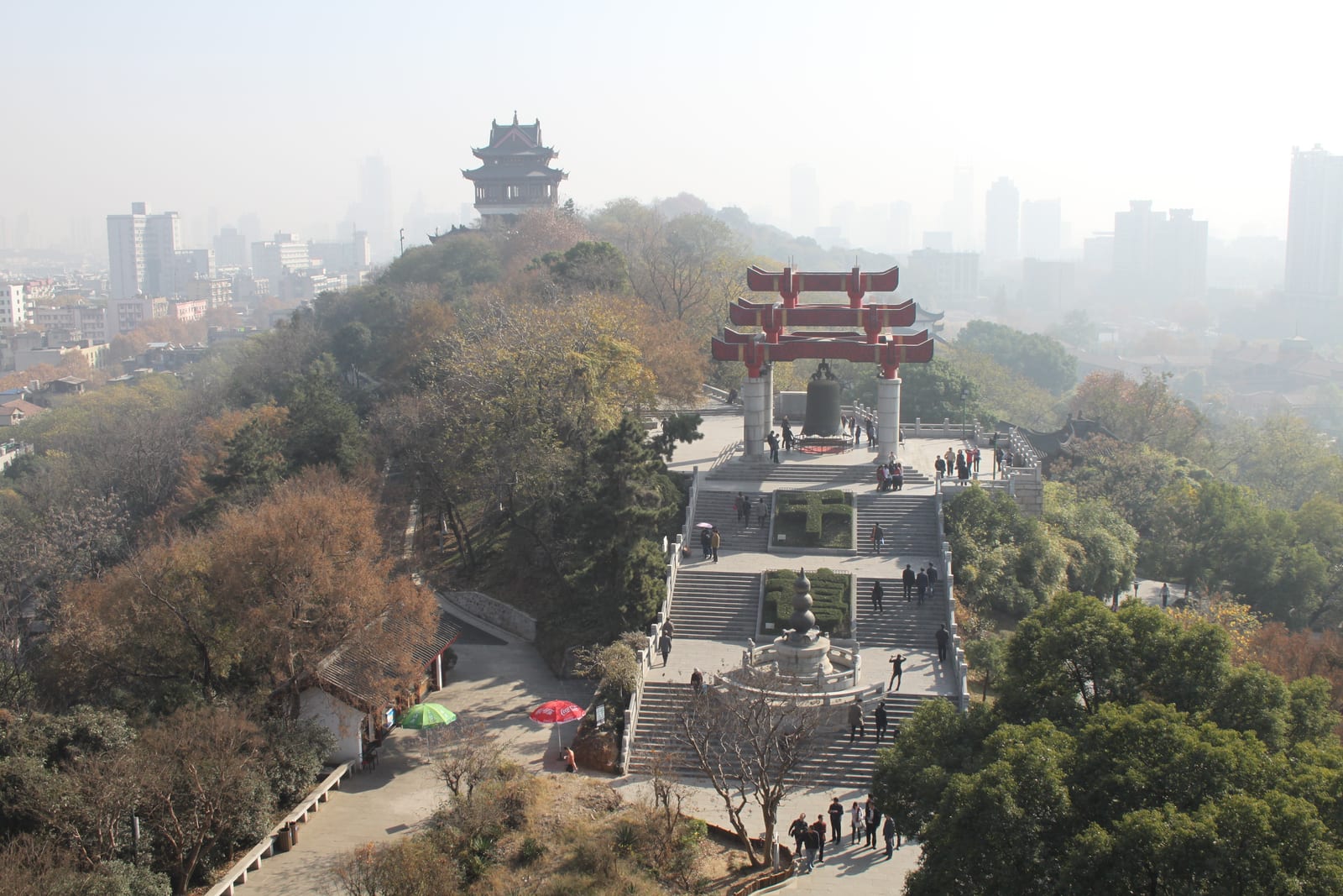 Main tower, sweeping roofs and surrounding trees at Yellow Crane Tower in Wuhan